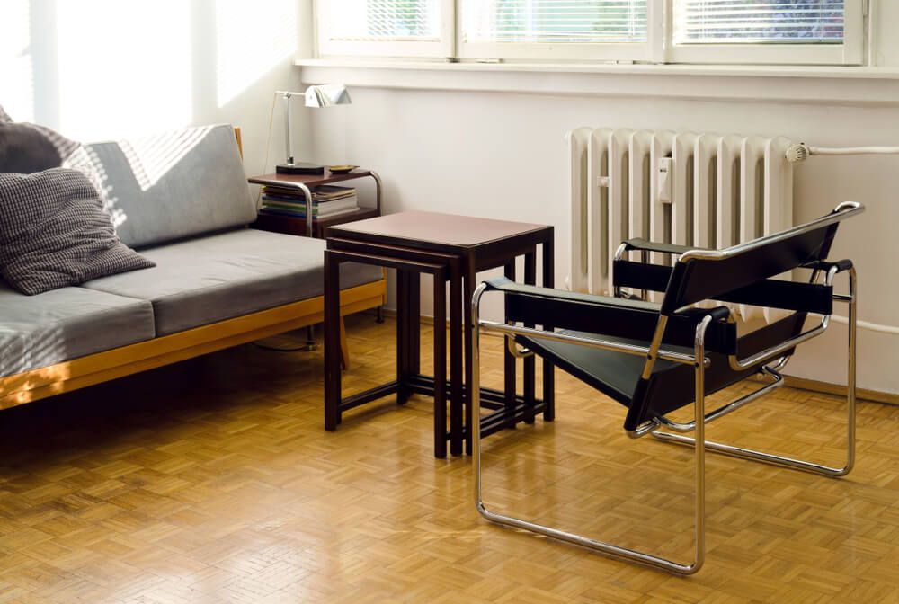 black wassily armchair with table and sofa
